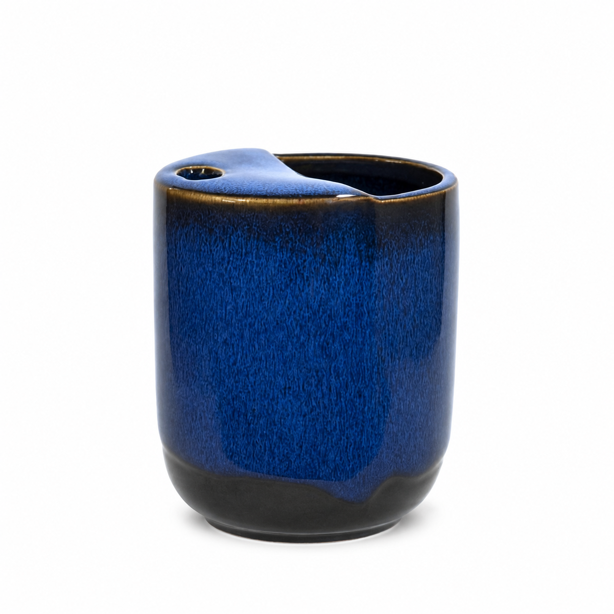 Handmade blue ceramic mug with handleless design and unique top opening