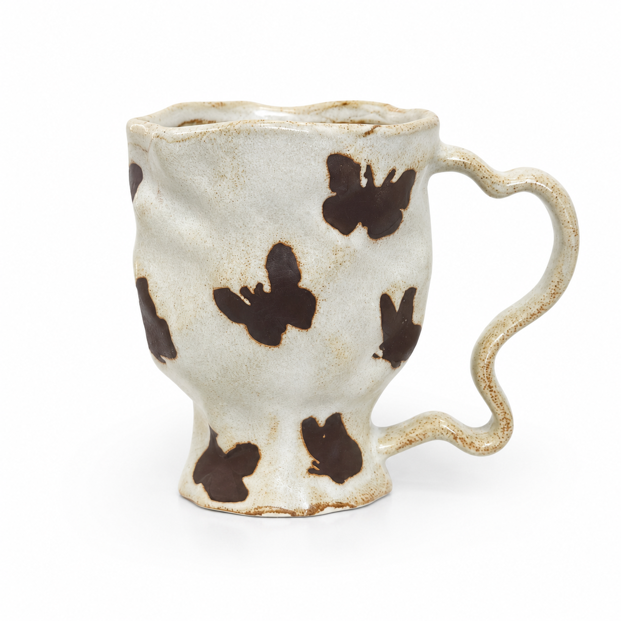 Handmade butterfly ceramic mug with wavy rim, sculptural handle, and ivory glaze