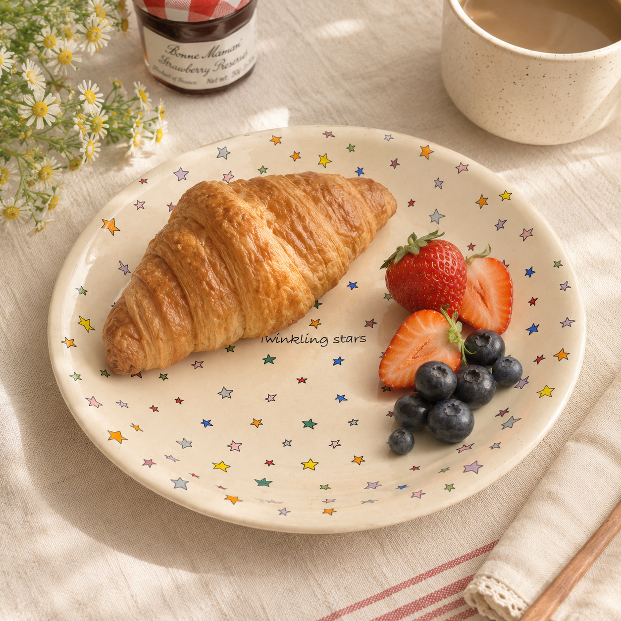 Twinkling Stars ceramic plate served with croissant, strawberries, and blueberries