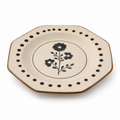 Black floral ceramic plate with brown dot border and speckled cream glaze