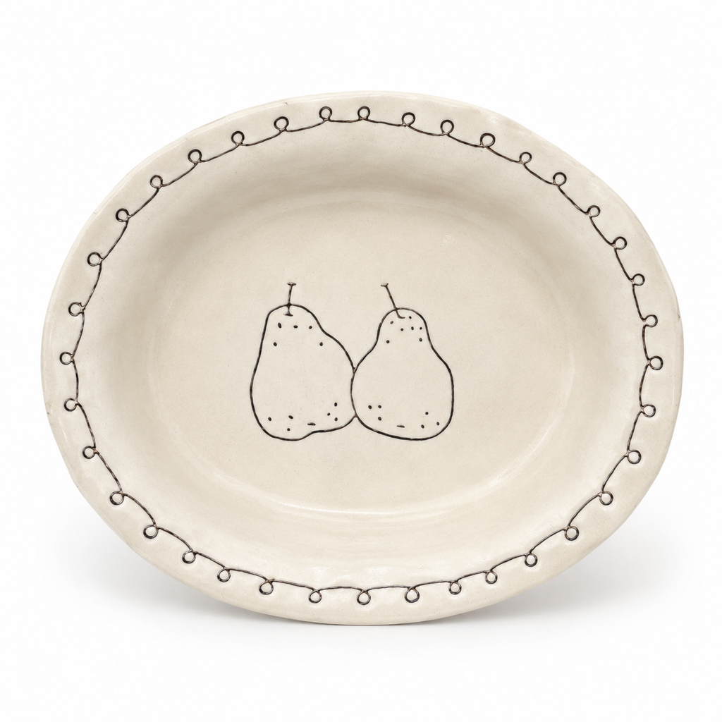Handmade pear ceramic oval deep plate with cream glaze and brown loop border