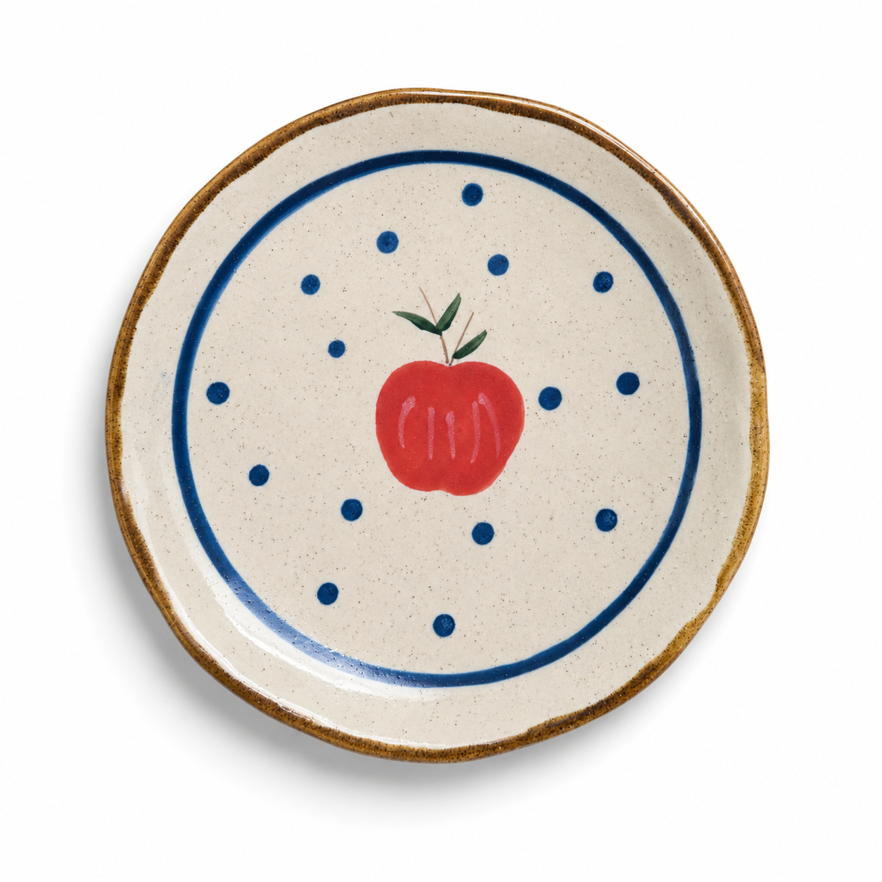 Handmade apple ceramic plate with red apple, blue dots, and speckled cream glaze