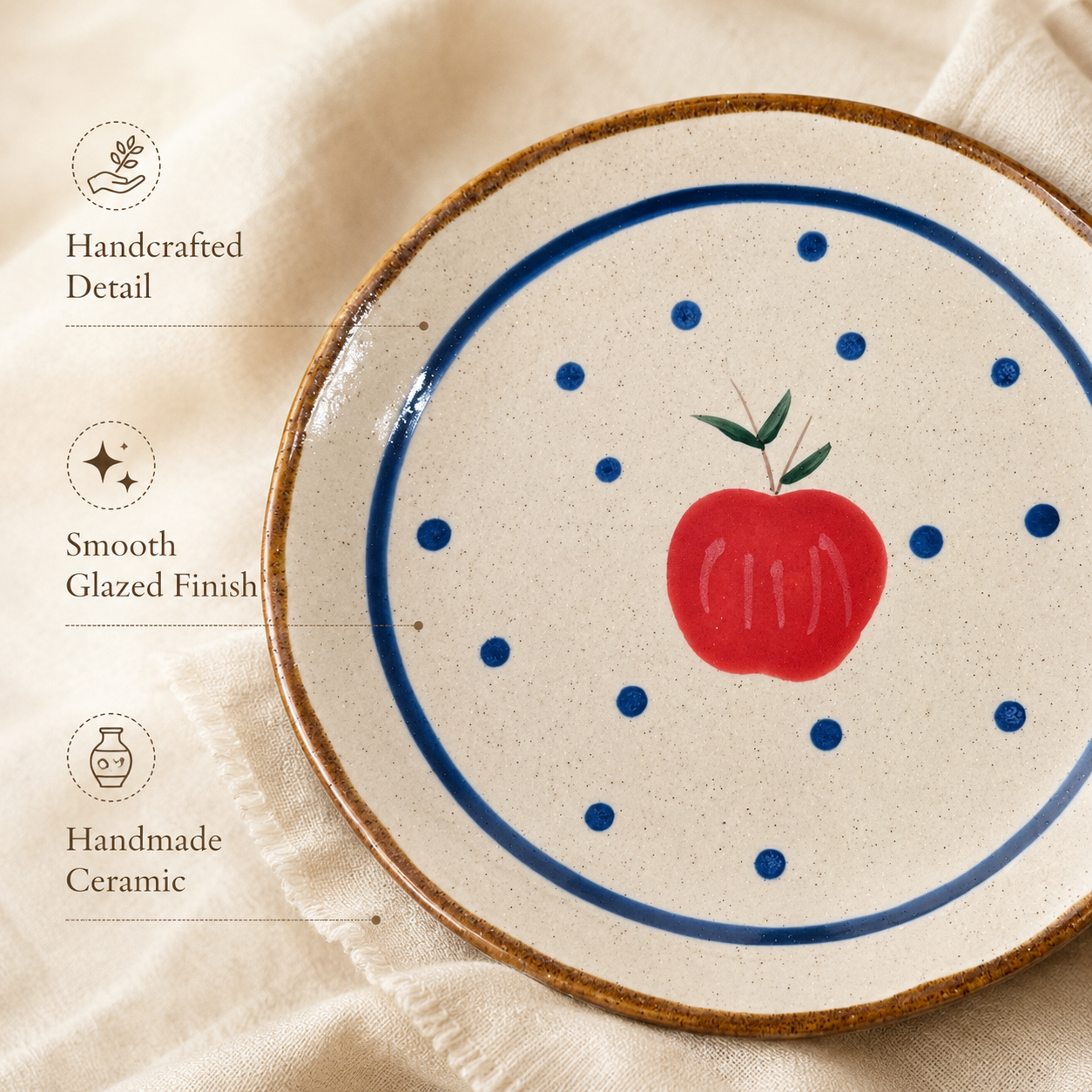 Close-up of apple ceramic plate with blue dots, brown rim, and smooth glazed finish