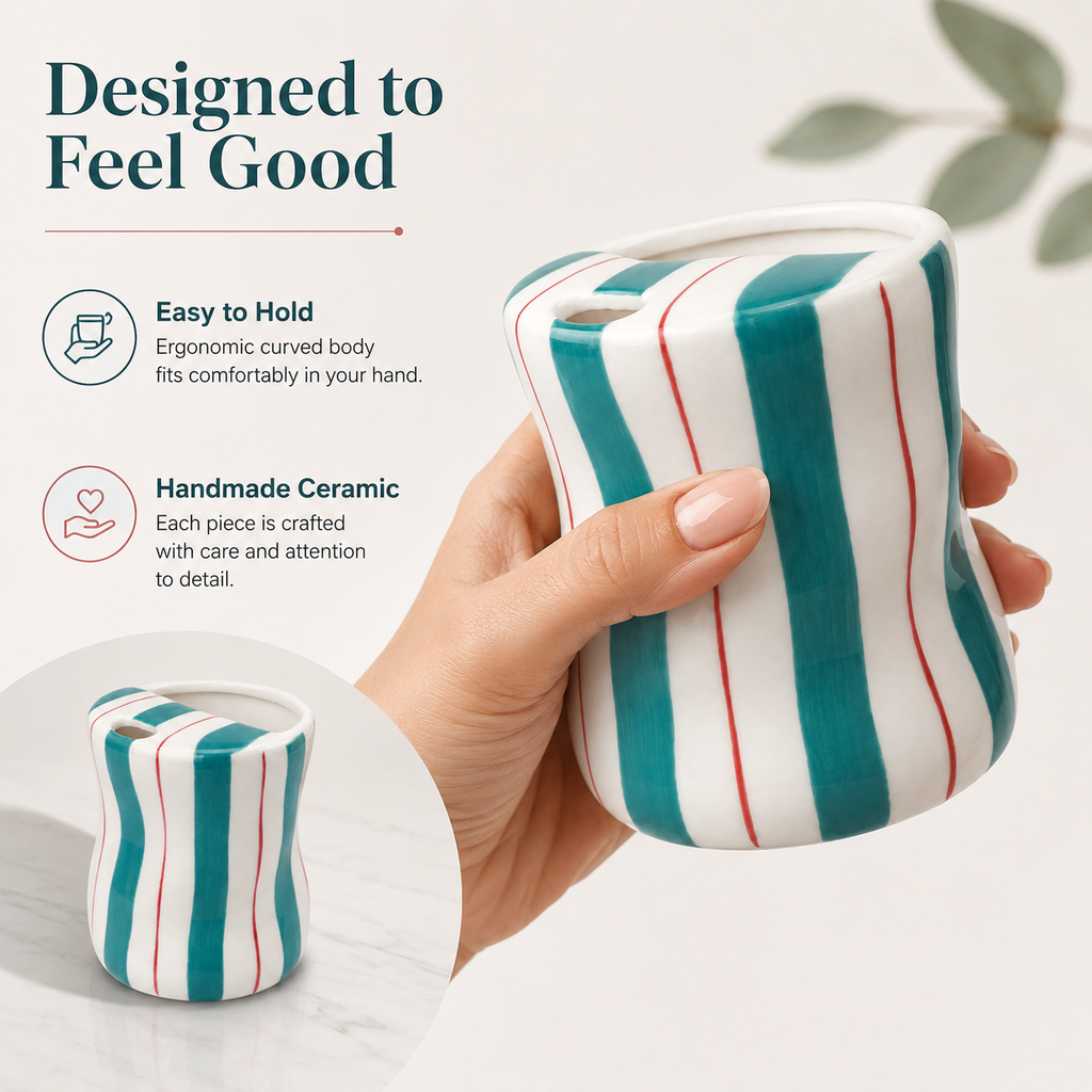 Handmade teal striped ceramic mug with comfortable curved body