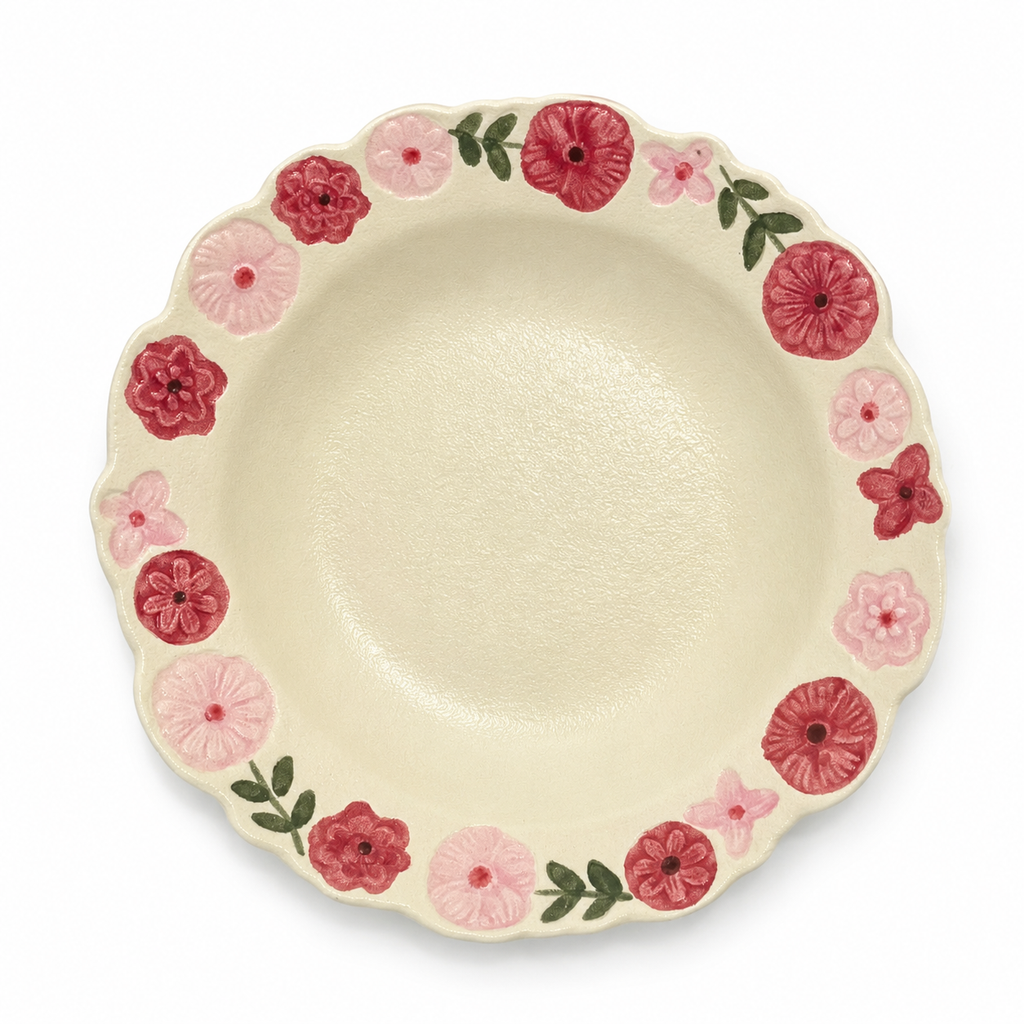 Hand-painted floral ceramic deep plate with scalloped rim and cream glaze