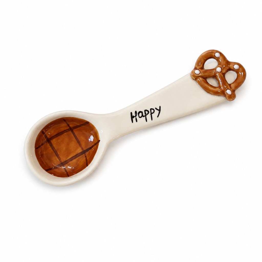 Handmade pretzel ceramic spoon with brown glaze and Happy lettering